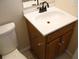 Traditional bathroom vanity with white countertops and a sink at 7319 Holiday Dr, Spring Hill, FL 34606