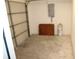 Spacious garage with door and ample room for parking and storage at 7319 Holiday Dr, Spring Hill, FL 34606