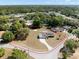 An aerial view shows the home and property outlined in red within a neighborhood at 7346 Hiawatha Pkwy, Spring Hill, FL 34606