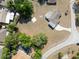 Aerial view of a home with a large yard and driveway in a suburban neighborhood at 7346 Hiawatha Pkwy, Spring Hill, FL 34606