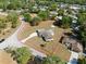 Aerial view showing the property outlined in red with driveway and surrounding homes at 7346 Hiawatha Pkwy, Spring Hill, FL 34606