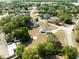Aerial view of the home situated on large lot surrounded by trees at 7346 Hiawatha Pkwy, Spring Hill, FL 34606