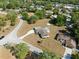 Birds eye view showing a home with large lot in a neighborhood with mature trees around it at 7346 Hiawatha Pkwy, Spring Hill, FL 34606