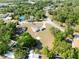An aerial view of a single-Gathering home featuring a large lot and a circular driveway at 7346 Hiawatha Pkwy, Spring Hill, FL 34606