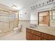 Well-lit bathroom with modern fixtures, a shower, and a vanity at 7346 Hiawatha Pkwy, Spring Hill, FL 34606