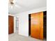 Bedroom boasts neutral walls, carpet, and large closet with wood sliding doors at 7346 Hiawatha Pkwy, Spring Hill, FL 34606