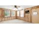 Cozy bonus room with wood paneling and direct access to the outdoors at 7346 Hiawatha Pkwy, Spring Hill, FL 34606