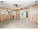 Versatile bonus room with wood accents, offering a seamless transition to the outdoors at 7346 Hiawatha Pkwy, Spring Hill, FL 34606
