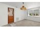 Dining room with a door that leads outside and ample natural light from windows at 7346 Hiawatha Pkwy, Spring Hill, FL 34606