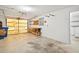 Spacious garage with roll up doors, shelving, and washer and dryer hook ups at 7346 Hiawatha Pkwy, Spring Hill, FL 34606