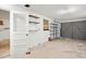 Spacious garage with roll up doors, shelving, and pedestrian entry door at 7346 Hiawatha Pkwy, Spring Hill, FL 34606
