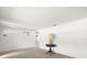Bright living room featuring neutral walls, carpet, and a decorative lamp at 7346 Hiawatha Pkwy, Spring Hill, FL 34606