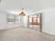 Spacious living room with sliding glass doors that offers great sunlight at 7346 Hiawatha Pkwy, Spring Hill, FL 34606