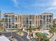 Scenic aerial view of the condominium complex with beautiful landscaping and community pool at 7400 Sun Island S Dr # 206, South Pasadena, FL 33707