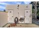 Community bathroom doors with outdoor water fountain and hose at 7400 Sun Island S Dr # 206, South Pasadena, FL 33707