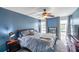 Charming bedroom with a comfortable bed, windows, and ceiling fan providing a relaxing retreat at 7400 Sun Island S Dr # 206, South Pasadena, FL 33707