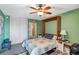 Bright bedroom featuring built-in headboard, and light-colored walls at 7400 Sun Island S Dr # 206, South Pasadena, FL 33707