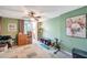 Bright bedroom with a ceiling fan, access to a patio, and ample room for relaxation and personalization at 7400 Sun Island S Dr # 206, South Pasadena, FL 33707