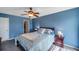Spacious bedroom featuring a cozy bed, ceiling fan, and ample natural light for a serene ambiance at 7400 Sun Island S Dr # 206, South Pasadena, FL 33707