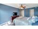 Comfortable bedroom with a well-appointed dresser, ceiling fan, and soothing color scheme at 7400 Sun Island S Dr # 206, South Pasadena, FL 33707