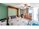 Comfortable bedroom with a stylish murphy bed, ceiling fan, and ample space for relaxation and storage at 7400 Sun Island S Dr # 206, South Pasadena, FL 33707