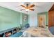 Comfortable bedroom featuring a ceiling fan, and a closet for ample storage at 7400 Sun Island S Dr # 206, South Pasadena, FL 33707