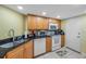 Kitchen features a stainless steel sink, matching appliances, and tiled flooring at 7400 Sun Island S Dr # 206, South Pasadena, FL 33707