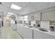 Well-maintained laundry room with a row of efficient washing machines available for residents at 7400 Sun Island S Dr # 206, South Pasadena, FL 33707