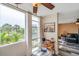 Inviting living area with large windows offering a scenic view and a ceiling fan for added comfort at 7400 Sun Island S Dr # 206, South Pasadena, FL 33707