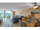 Open-concept living area with water views and a dining area with seating at 7400 Sun Island S Dr # 206, South Pasadena, FL 33707