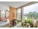 Open concept living room boasts natural light and scenic waterfront views through large windows at 7400 Sun Island S Dr # 206, South Pasadena, FL 33707