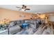 Spacious living room with a large sectional sofa and stylish decor at 7400 Sun Island S Dr # 206, South Pasadena, FL 33707