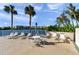 Relaxing pool deck and chairs with waterfront views for a comfortable outdoor experience at 7400 Sun Island S Dr # 206, South Pasadena, FL 33707