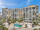 Waterfront condo with lush landscaping, a community pool and spa, and ample seating for residents to enjoy at 7400 Sun Island S Dr # 206, South Pasadena, FL 33707