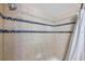 Modern shower with neutral tile and decorative blue glass accent at 7400 Sun Island S Dr # 206, South Pasadena, FL 33707