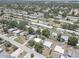 Birds eye view of a residential area with mature trees, roads, and well-spaced single-Gathering homes at 8358 Candlewood Rd, Seminole, FL 33777