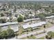 Wide aerial view of a well-maintained neighborhood featuring numerous homes at 8358 Candlewood Rd, Seminole, FL 33777