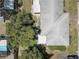 Aerial view of a neighborhood showcasing the community layout and surrounding greenery at 8358 Candlewood Rd, Seminole, FL 33777