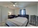 Comfortable bedroom features neutral paint, a ceiling fan, and a plush, luxurious bed at 8358 Candlewood Rd, Seminole, FL 33777