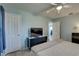 Comfortable bedroom featuring a ceiling fan, neutral color palette, and closet at 8358 Candlewood Rd, Seminole, FL 33777