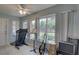 Well-lit bonus room with large windows, ceiling fan, and versatile space at 8358 Candlewood Rd, Seminole, FL 33777