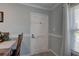 Cozy entryway features a window, rug, door with decorations, and a dining table at 8358 Candlewood Rd, Seminole, FL 33777