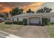 Charming single-story home with a well-maintained lawn, driveway, and attached one car garage at 8358 Candlewood Rd, Seminole, FL 33777