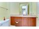 Bathroom featuring a toilet, vanity, and mirror, offering essential amenities in a cozy space at 8474 Dunham Station Dr, Tampa, FL 33647