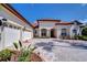 Beautiful single-story home with a tile roof, three-car garage, and well-maintained landscaping at 8474 Dunham Station Dr, Tampa, FL 33647