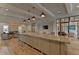 Open-concept common area with a large island and comfortable seating arrangements at 8474 Dunham Station Dr, Tampa, FL 33647