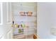 Organized pantry with wire shelving for optimal storage and accessibility in the kitchen area at 8474 Dunham Station Dr, Tampa, FL 33647