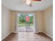 View of the bedroom with a sliding glass door that leads to the patio at 8600 Village Mill Row, Hudson, FL 34667