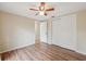 Bedroom features new floors, neutral paint, closet and entry door at 8600 Village Mill Row, Hudson, FL 34667