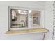 View of kitchen through sliding glass window featuring white cabinetry at 8600 Village Mill Row, Hudson, FL 34667